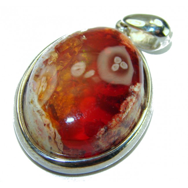 Inner Fire Natural 20.2 carat Mexican Fire Opal .925 Sterling Silver dipped in rhodium handmade Pendant - Close-up of Mexican Fire Opal pendant with sterling silver setting.