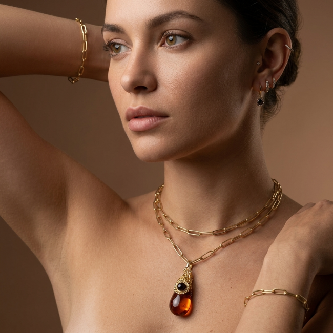 Prehistoric Authentic Baltic Amber 18K Gold over .925 Sterling Silver beautifully handcrafted Pendant - Side view of necklace and earrings worn by model showcasing amber pendant.