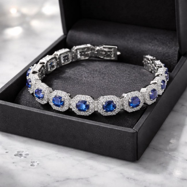 Beauty of Nature - natural 22.5 carat Sapphire .925 Sterling Silver handmade Statement Bracelet - Sapphire bracelet in box, top view showcasing stones and silver setting.