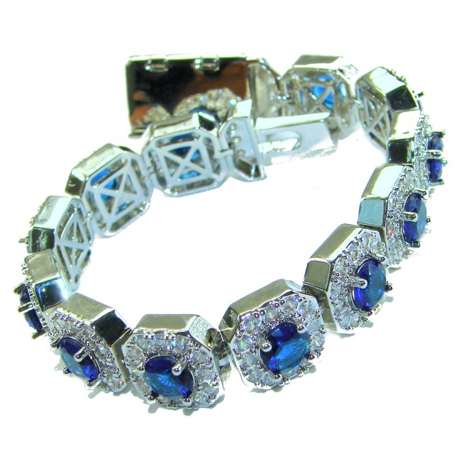 Beauty of Nature - natural 22.5 carat Sapphire .925 Sterling Silver handmade Statement Bracelet - Silver bracelet with blue sapphires, clasp detail, and gemstone focus.