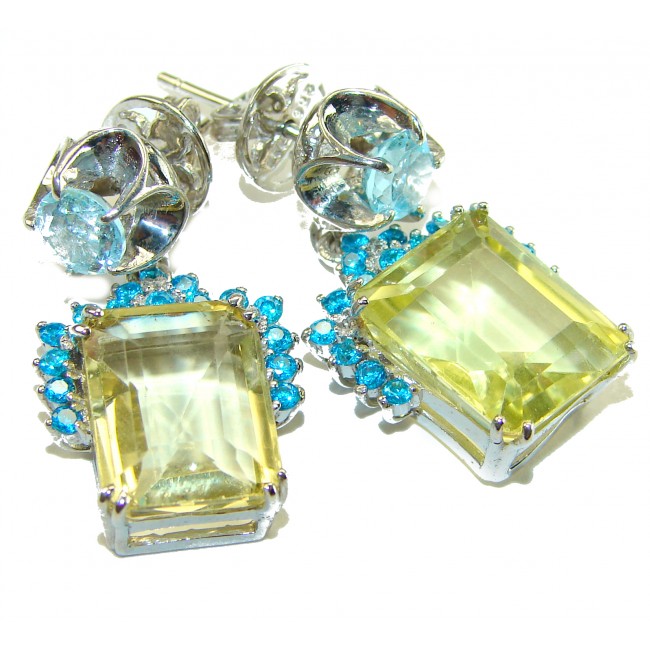 Giovanna - Authentic 12.9 carat Brazilian Citrine .925 Sterling Silver dipped in rhodium handcrafted earrings - Close-up of citrine earrings with blue accent stones and sterling setting.