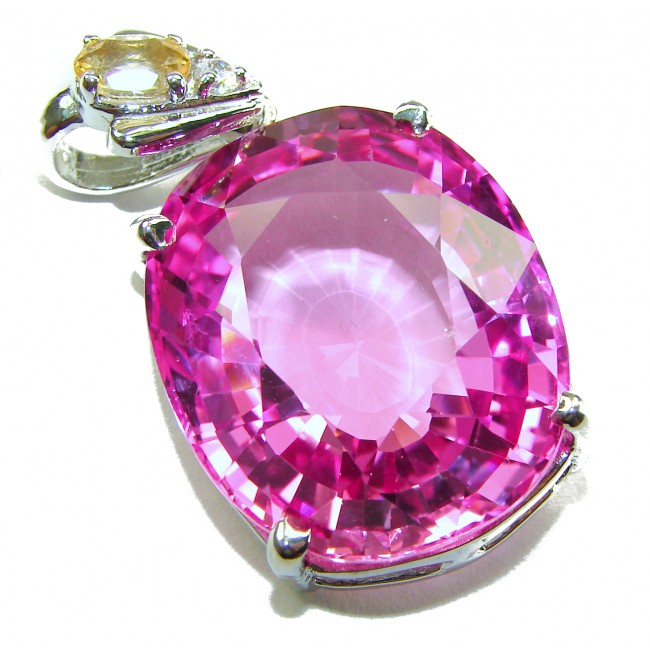 Incredible oval cut 27.8 carat Pink Sapphire .925 Sterling Silver handcrafted pendant - Close-up of oval cut 27.8 carat pink sapphire pendant in sterling silver.