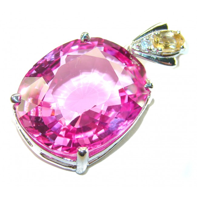 Incredible oval cut 27.8 carat Pink Sapphire .925 Sterling Silver handcrafted pendant - Close-up of oval cut 27.8 carat pink sapphire pendant in silver setting.