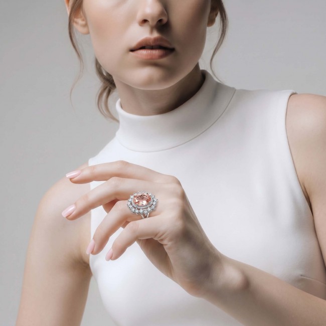 Authentic oval cut 9.2 carat Morganite 14K White Gold over .925 Sterling Silver ring s. 8 1/4 - Woman wearing oval cut Morganite ring on hand, front view.