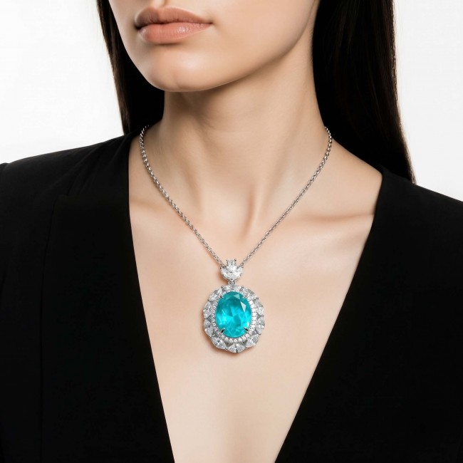 Wonderland 15.8 carat classic oval cut Paraiba Tourmaline .925 Sterling Silver Handcrafted Statement necklace - Model wearing Wonderland oval Paraiba Tourmaline necklace, front view.