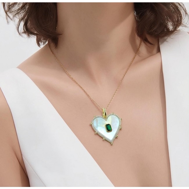 Precious Heart Blister Pearl 0.9 carat Emerald .925 Sterling Silver dipped in 18K Gold Pendant - Heart-shaped pearl and emerald necklace worn on neck, front view.