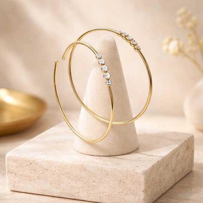Allure Natural 4.2 carat White Topaz .925 Sterling Silver dipped in 18K Gold handcrafted hoop earrings 1 7/8 inch long - Hoop earrings side view with white topaz on a stone display stand.
