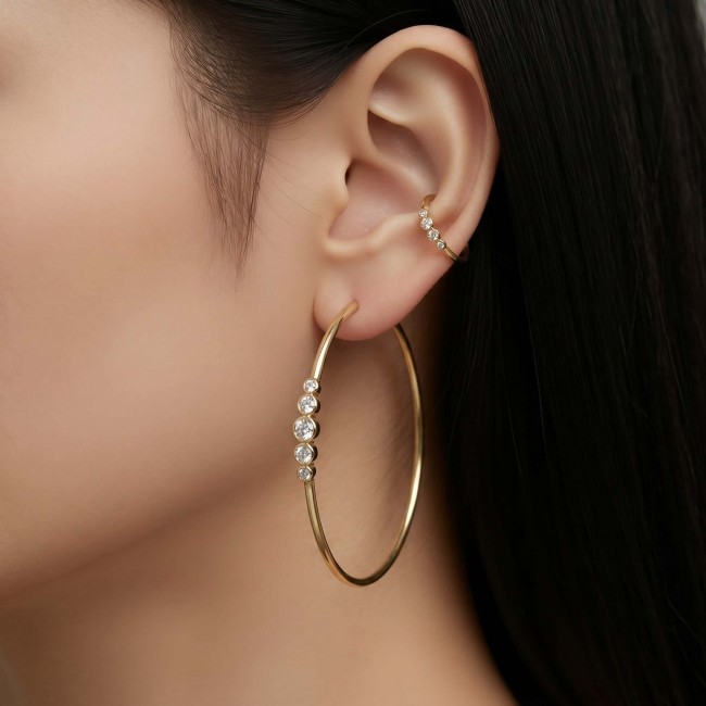 Allure Natural 4.2 carat White Topaz .925 Sterling Silver dipped in 18K Gold handcrafted hoop earrings 1 7/8 inch long - Side view of gold hoop earrings with white topaz stones worn on ear.
