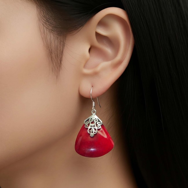 Elizabeth Natural Fossilized Coral .925 Sterling Silver handcrafted earrings - Red fossilized coral earring in side view, worn on ear.