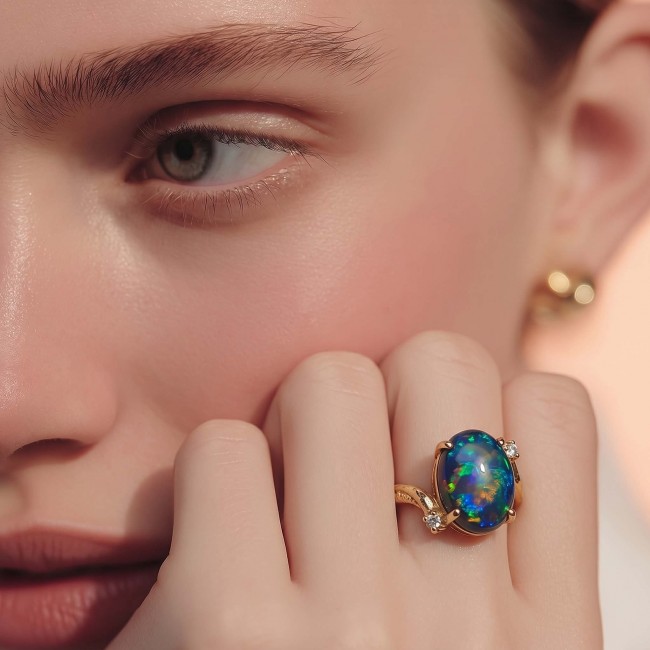 A Milky Way Genuine 4.8 carat Black Opal 18K Gold over .925 Sterling Silver handmade Ring size 7 1/2 - Opal ring worn on hand, showing close-up of 4.8 carat stone in 18K gold.