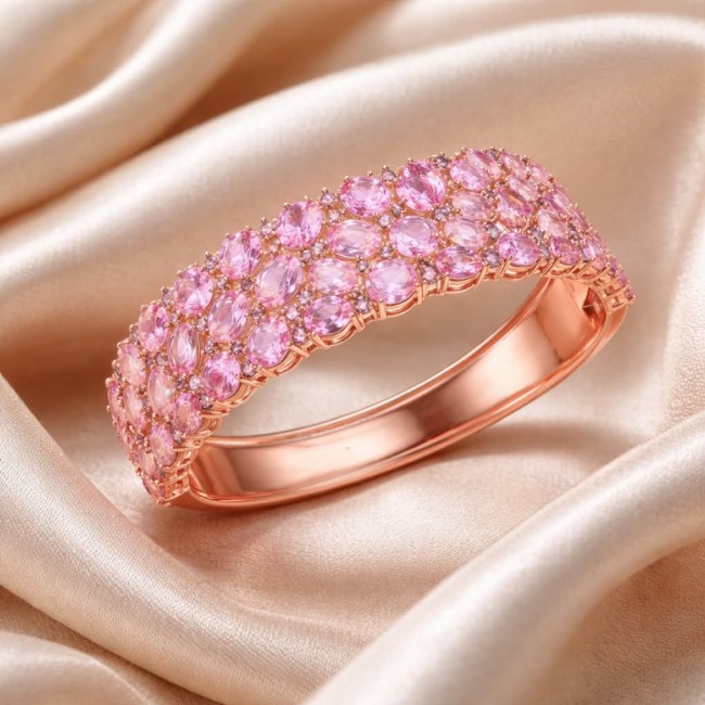 Luxurious 85.4 carat Pink Sapphire 22K real ROSE Gold over .925 Sterling Silver handcrafted Bracelet - Pink sapphire ring in 22K rose gold, side view on satin background.