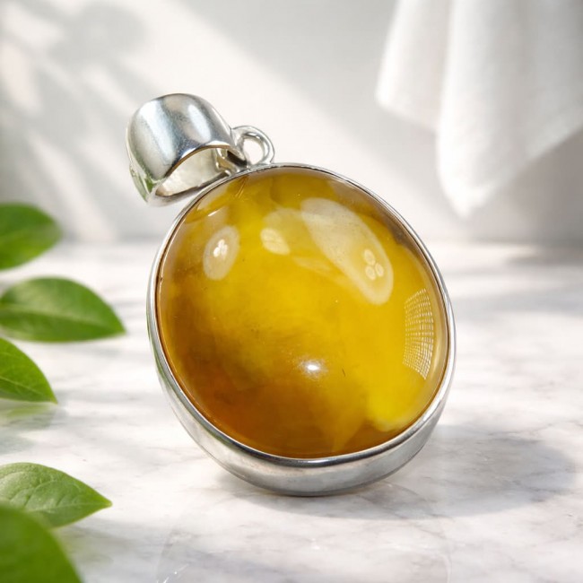 Prehistoric Authentic Baltic Amber .925 Sterling Silver beautifully handcrafted Pendant - Close-up of Baltic amber pendant in sterling silver setting