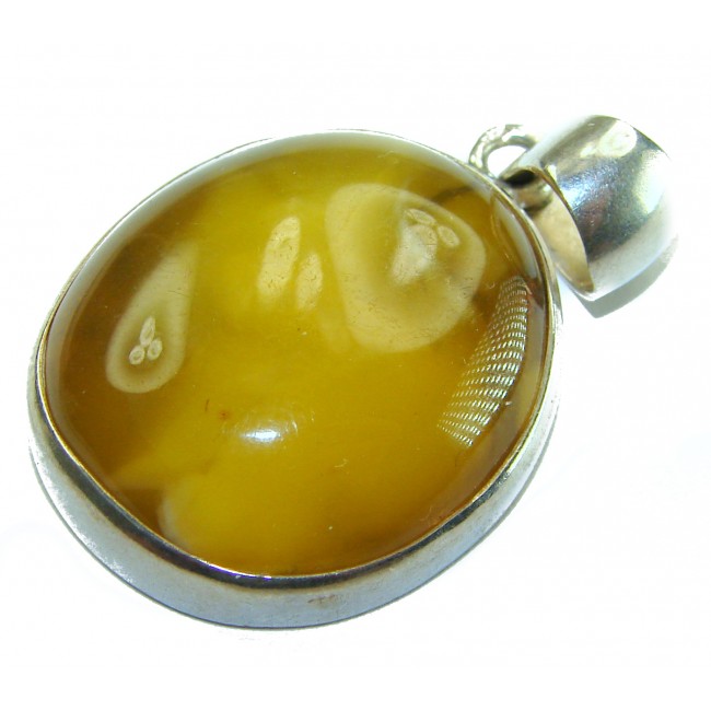 Prehistoric Authentic Baltic Amber .925 Sterling Silver beautifully handcrafted Pendant - Close-up of Baltic amber pendant with silver setting.