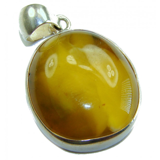 Prehistoric Authentic Baltic Amber .925 Sterling Silver beautifully handcrafted Pendant - Amber pendant in sterling silver setting, close-up view.