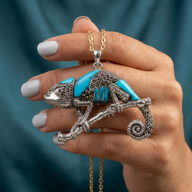 Spectacular Big Chameleon Lizard inlay Turquoise .925 Sterling Silver handmade Brooch - Turquoise chameleon pendant in hand, side view, gold chain visible