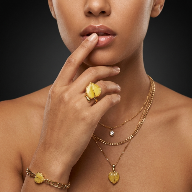 Golden Leaf - Natural Butterscotch Baltic Amber .925 Sterling Silver dipped in 18K Gold handcrafted ring; s. 7 adjustable - Model wearing Golden Leaf Baltic Amber jewelry set, close-up front view.