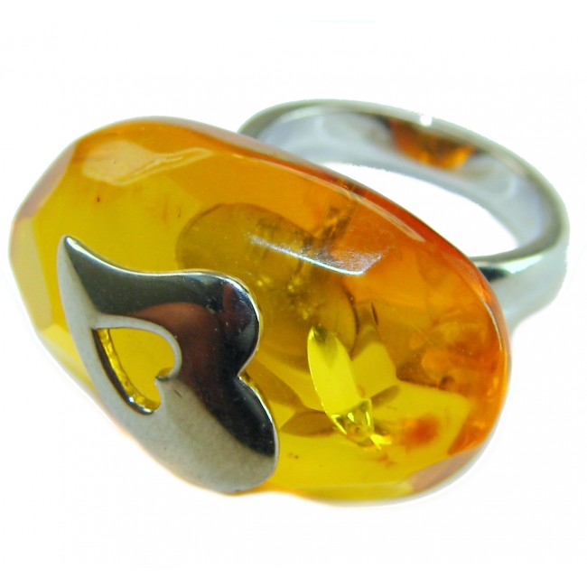 Heart Authentic Baltic Amber .925 Sterling Silver handcrafted ring; s. 6 ADJUSTABLE - Close-up of heart amber ring with silver band, showcasing stone detail.