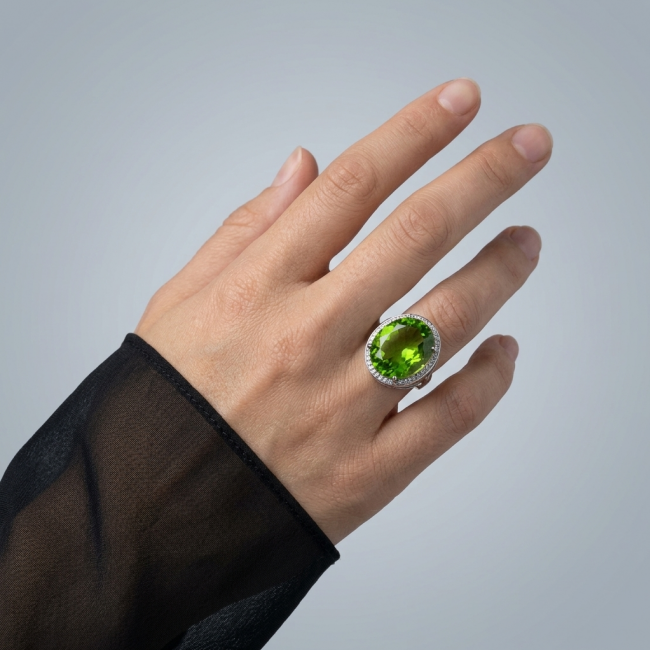 Authentic 22.8 carat Green Neon Topaz .925 Sterling Silver handmade Ring s. 6 1/4 - Green neon topaz ring on hand, angled view, 22.8 carat, sterling silver