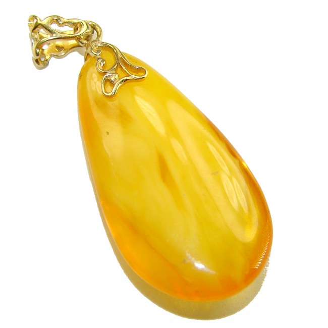 Prehistoric Authentic Baltic Amber REAL 14k Gold beautifully handcrafted Pendant - Golden amber pendant with intricate 14k gold filigree from side view.