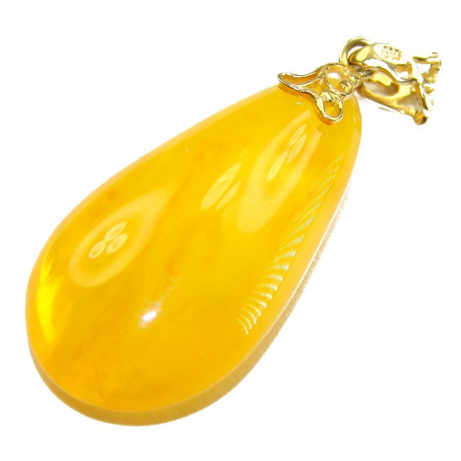 Prehistoric Authentic Baltic Amber REAL 14k Gold beautifully handcrafted Pendant - Close-up of Baltic amber pendant with 14k gold detail.