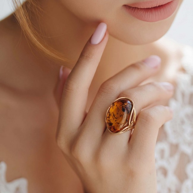 Authentic Baltic Amber 14K Gold over .925 Sterling Silver handcrafted ring; s. 7 adjustable - Amber ring on hand, close-up, 14K gold over sterling silver.