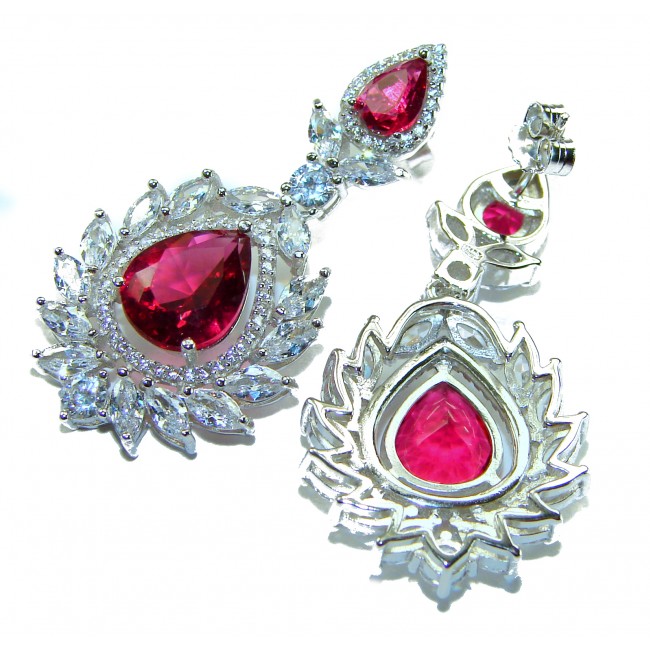 Tiffany - authentic 7.5 carat Ruby .925 Sterling Silver dipped in rhodium handcrafted Statement Earrings - Close-up of Tiffany ruby earrings in sterling silver with decorative stones.