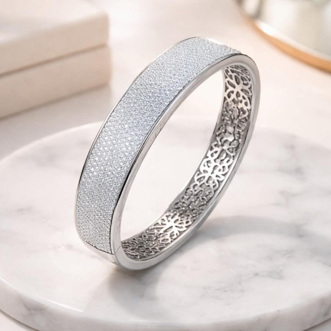 Tiffany Genuine 28.5 carat White Topaz rhodium over .925 Sterling Silver handcrafted Statement bracelet - Side view of Tiffany 28.5 carat White Topaz rhodium bracelet on marble.