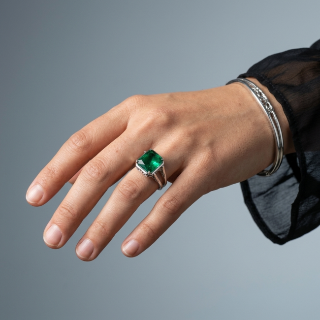 Authentic 10.2 carat Colombian Emerald .925 Sterling Silver handcrafted two sided Ring size 8 - Emerald ring on hand, showcasing green stone on sterling silver band.