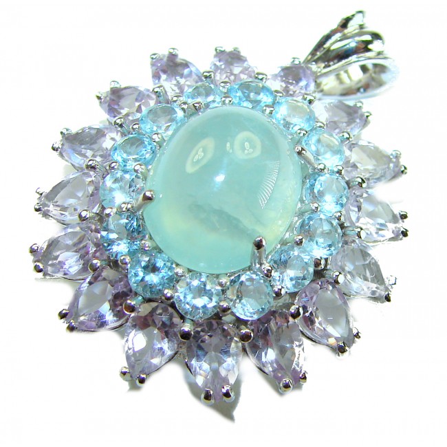 Royal quality genuine 19.8 carat Prehnite rhodium over .925 Sterling Silver handcrafted Pendant - Close-up of a Prehnite pendant with surrounding gemstones and rhodium setting.