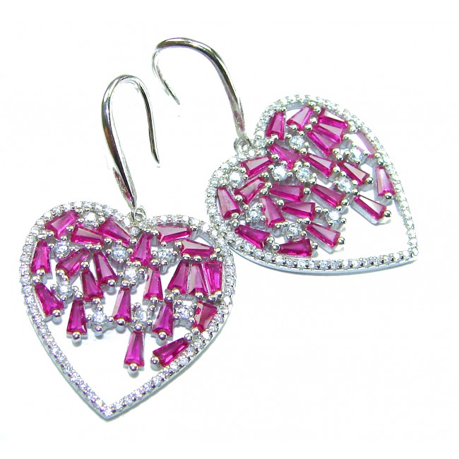 Precious Hearts - authentic 12.5 carat Mozambique Ruby .925 Sterling Silver dipped in rhodium handcrafted Statement Earrings - Heart-shaped ruby earrings, front view with silver hooks.