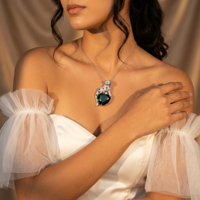 Passionate Love Cheetah authentic 38.5 carat Emerald .925 Sterling Silver Handcrafted pendant brooch - Woman wearing Passionate Love Cheetah necklace with 38.5 carat emerald.