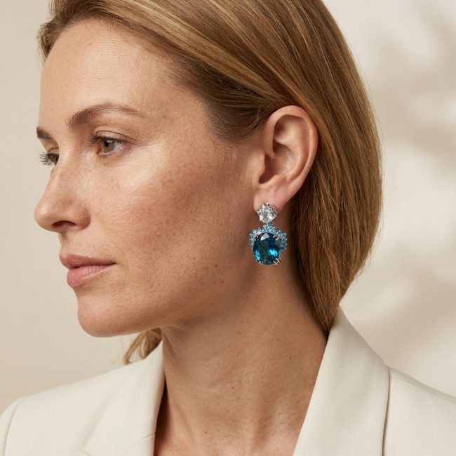 Andrea 24.5 carat London Blue Topaz Aquamarine .925 Sterling Silver handmade earrings - Side view, woman wearing Andrea 24.5 ct London Blue Topaz earrings.