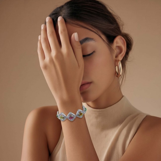 Authentic 22.5 carat Brazilian Watermelon Tourmaline 14K White Gold over .925 Sterling Silver handmade Bracelet - Model wearing bracelet, front view, with hand covering part of face.