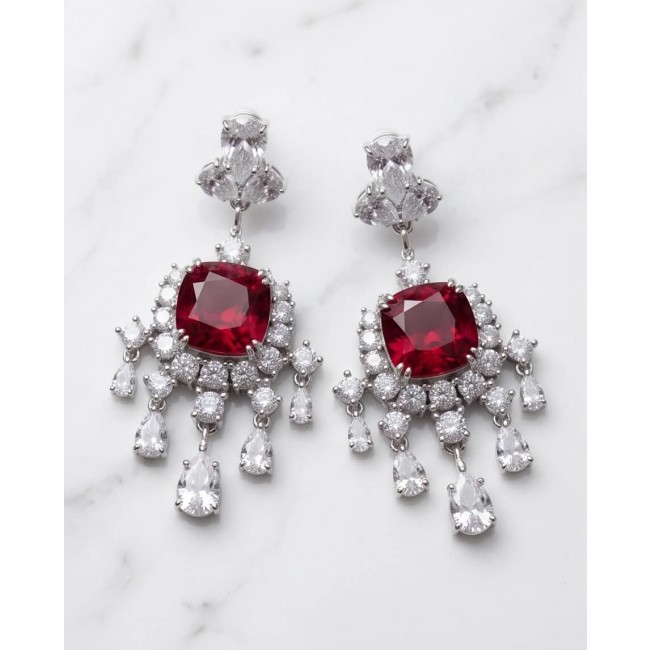 Anna Maria- authentic 6.5 carat Ruby .925 Sterling Silver dipped in rhodium handcrafted Statement Earrings - Elegant ruby earrings with diamonds, front view, on a marble background.