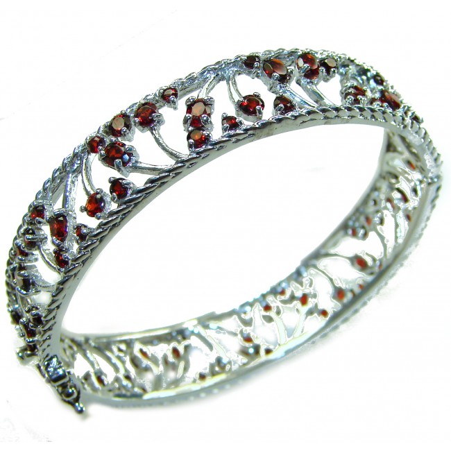 Authentic 18.2 carat Garnet .925 Sterling Silver handmade bangle Bracelet - Side view of sterling silver bracelet with garnet stones.