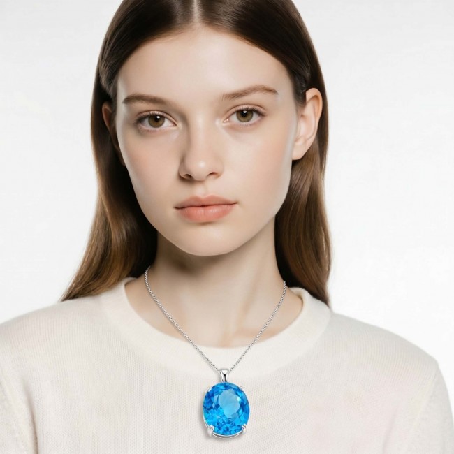 Vintage style 20.8 carat Swiss Blue Topaz .925 Sterling Silver DIPPED IN RHODIUM handmade Pendant - Model wearing vintage style blue topaz necklace, front view.