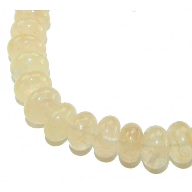 Victoria Authentic 228.5 carat Brazilian Citrine .925 Sterling Silver brilliantly handcrafted Statement necklace - Close-up of round Brazilian Citrine beads on a necklace.