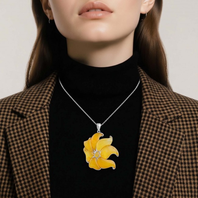 Golden Wild Lotus Natural Butterscotch Baltic Polish Amber .925 Sterling Silver dipped in rhodium handcrafted Pendant - Necklace with golden lotus pendant worn on a woman's neck.