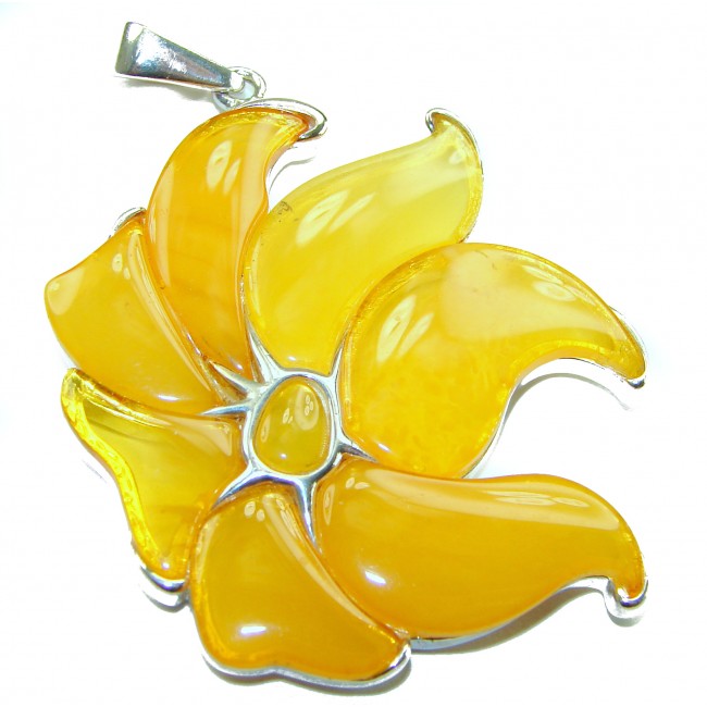 Golden Wild Lotus Natural Butterscotch Baltic Polish Amber .925 Sterling Silver dipped in rhodium handcrafted Pendant - Golden Wild Lotus Amber pendant, top view showing intricate petals.