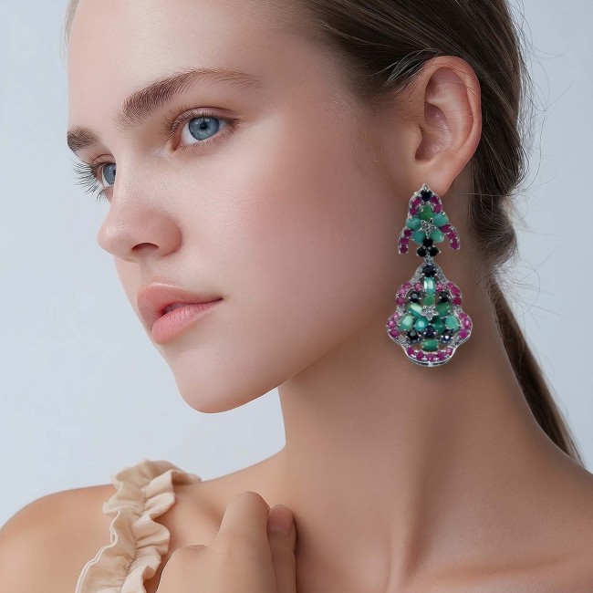 Giovanna - Authentic 28.9 carat COLOMBIAN EMERALD .925 Sterling Silver dipped in rhodium handcrafted earrings - Side view of model wearing Giovanna Colombian emerald earrings.