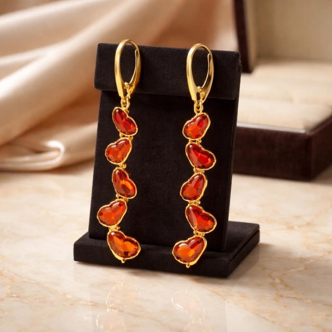 Butterflies carved Baltic Polish Amber 18K Gold over .925 Sterling Silver handcrafted earrings - Amber earrings with butterflies, front view, on black stand.