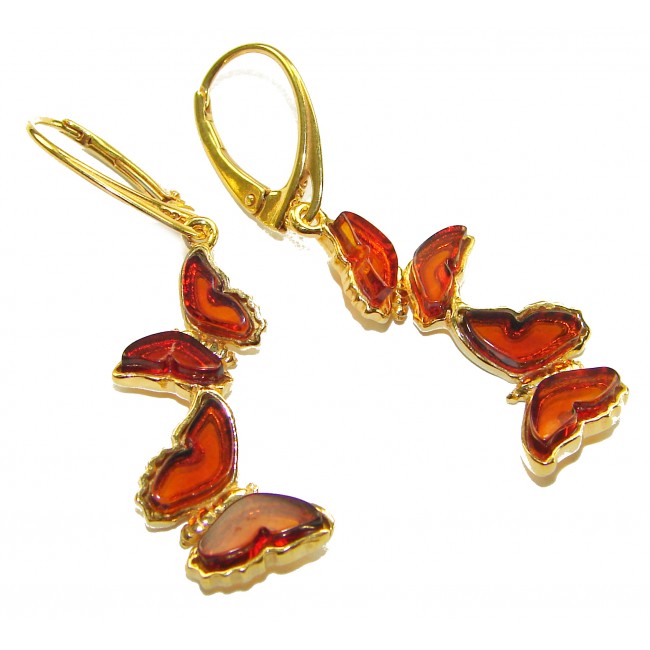 Butterflies carved Baltic Polish Amber 18K Gold over .925 Sterling Silver handcrafted earrings - Butterfly amber earrings, gold setting, close-up view.