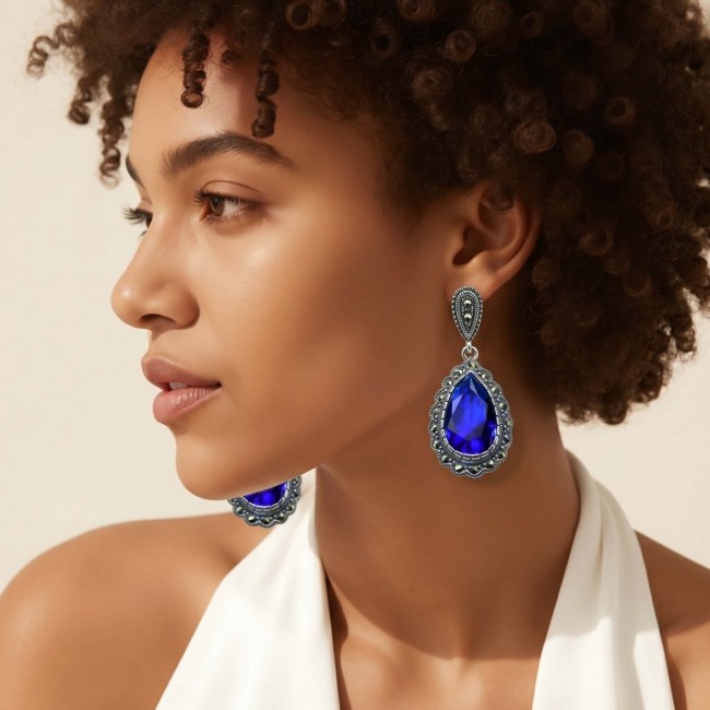 Julietta 15.5 carat London Blue Topaz Marcasite .925 Sterling Silver handmade Statement earrings - Side view of woman wearing Julietta blue topaz marcasite earrings.