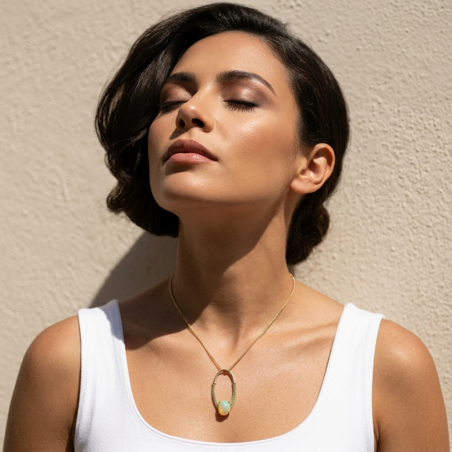 Stella Authentic 10.8 Ethiopian Opal Emerald 18K Gold over .925 Sterling Silver handcrafted Pendant - Woman wearing Stella Opal pendant, eyes closed, front view