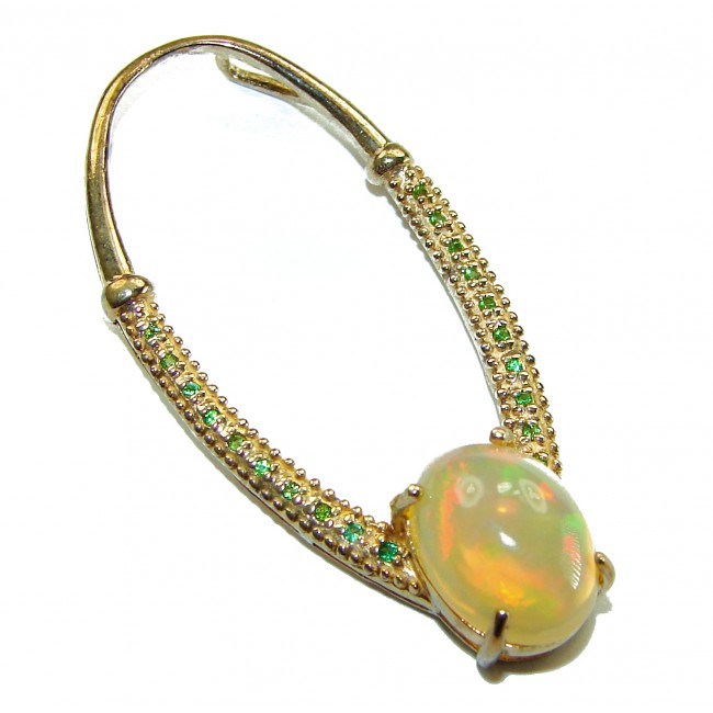 Stella Authentic 10.8 Ethiopian Opal Emerald 18K Gold over .925 Sterling Silver handcrafted Pendant - Opal and emerald earring in 18K gold, angled close-up view.
