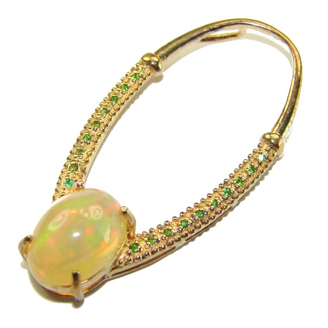 Stella Authentic 10.8 Ethiopian Opal Emerald 18K Gold over .925 Sterling Silver handcrafted Pendant - Close-up of opal and emerald oval bracelet in 18K gold.