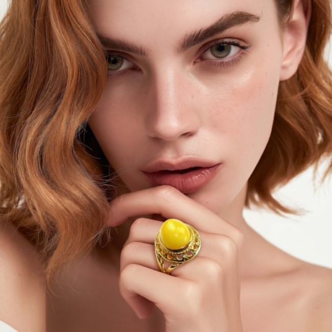 Authentic Butterscotch Baltic Amber 18K Gold over .925 Sterling Silver handcrafted ring; s. 7 adjustable - Amber ring close-up, worn on hand, highlighting intricate gold setting.