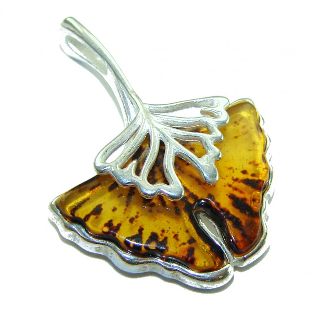Sea Treasure Prehistoric Authentic Butterscotch Baltic Amber .925 Sterling Silver beautifully handcrafted Pendant - Ginkgo leaf pendant, close-up showing amber and silver details.