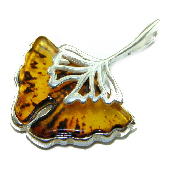 Sea Treasure Prehistoric Authentic Butterscotch Baltic Amber .925 Sterling Silver beautifully handcrafted Pendant - Close-up of leaf-shaped amber pendant with silver detailing