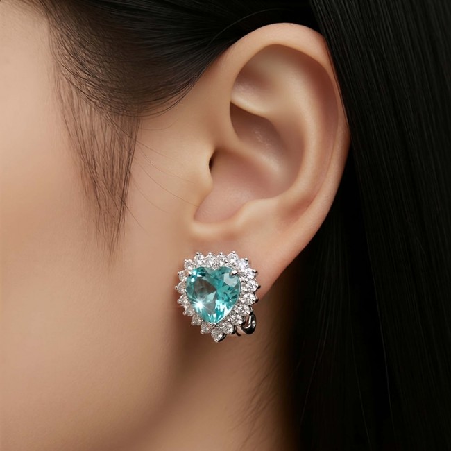 Angel's Heart 4.7 carat Swiss Blue Topaz .925 Sterling Silver Handcrafted earrings - Swiss Blue Topaz earrings worn on ear, silver setting detail shown